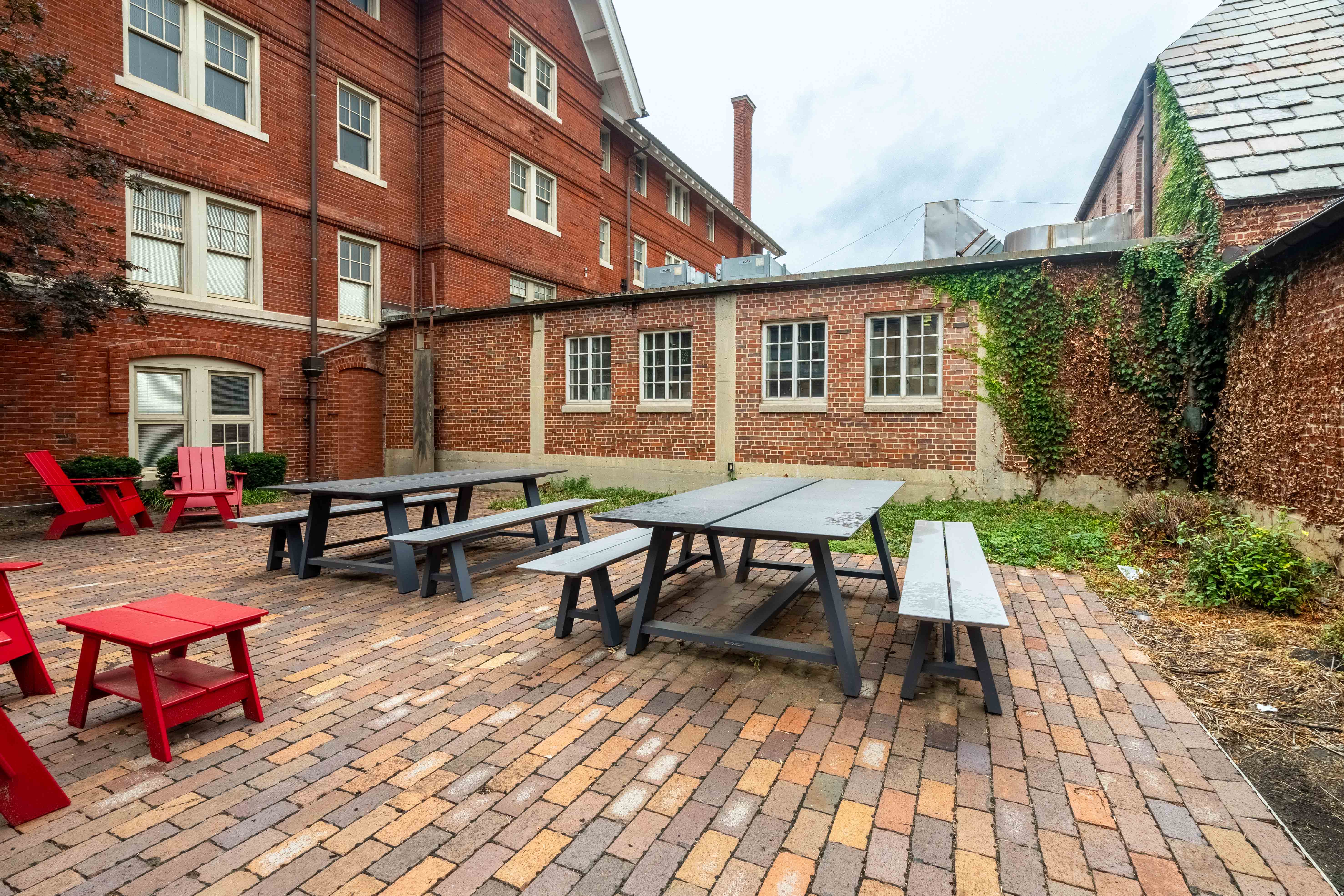 Picnic tables and chairs in a courtyard