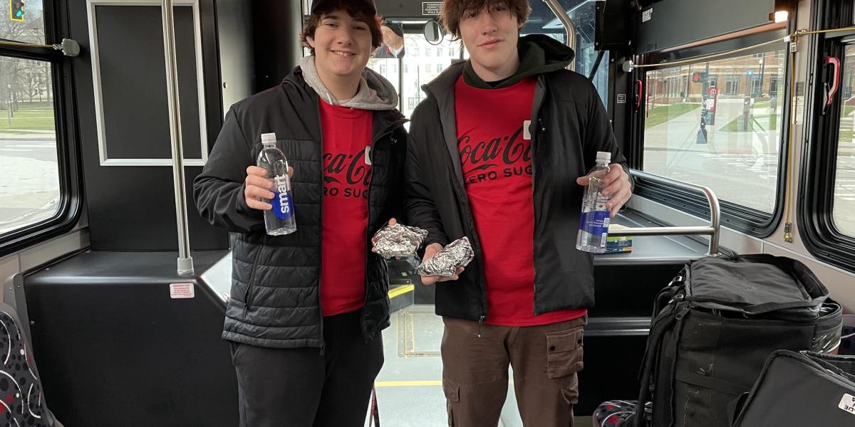 Two people in a CABS bus.