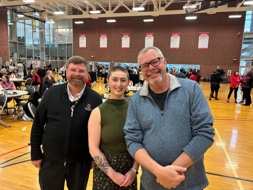 three people together smiling